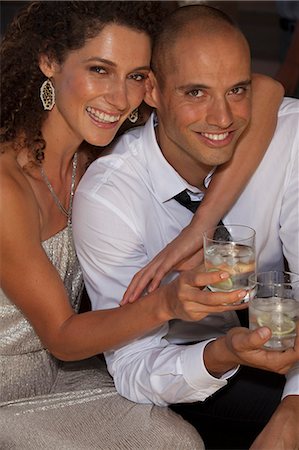 simsearch:6113-07790495,k - Couple hugging at party Stock Photo - Premium Royalty-Free, Code: 6113-06909127