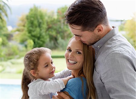 simsearch:6113-06498556,k - Family smiling together outdoors Stock Photo - Premium Royalty-Free, Code: 6113-06909366