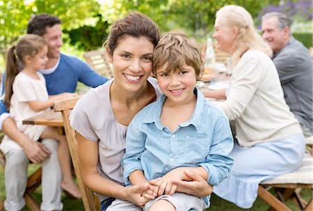 senior family sitting - Mother and son smiling in backyard Stock Photo - Premium Royalty-Free, Code: 6113-06909440