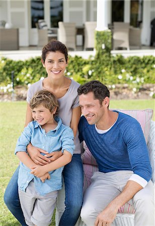 dad with kids - Family smiling outside house Stock Photo - Premium Royalty-Free, Code: 6113-06909438