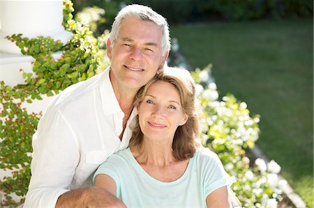 senior couple garden - Portrait of smiling senior couple in garden Stock Photo - Premium Royalty-Free, Code: 6113-07146954