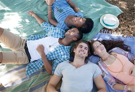 simsearch:6113-07147024,k - Friends laying on blankets outdoors Stock Photo - Premium Royalty-Free, Code: 6113-07146979