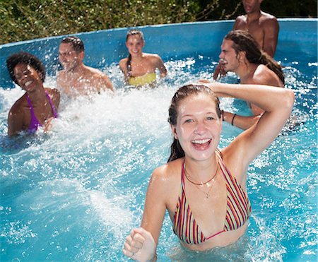 simsearch:6113-07147417,k - Friends playing in swimming pool Stock Photo - Premium Royalty-Free, Code: 6113-07146983