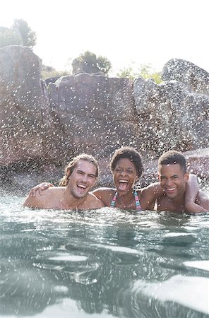 swimming, happy - Friends laughing in river Stock Photo - Premium Royalty-Free, Code: 6113-07147085
