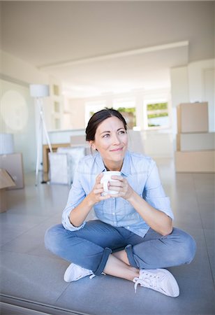 property - Happy woman enjoying coffee among cardboard boxes Stock Photo - Premium Royalty-Free, Code: 6113-07147175