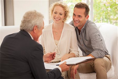 financial occupation - Financial advisor talking with clients Stock Photo - Premium Royalty-Free, Code: 6113-07147676