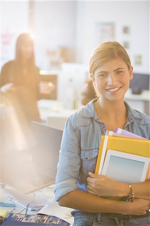 Portrait of businesswoman smiling in office Stock Photo - Premium Royalty-Free, Code: 6113-07147889