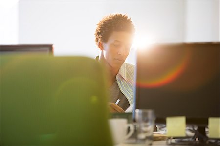 focused - Businessman working at desk in office Stock Photo - Premium Royalty-Free, Code: 6113-07147890