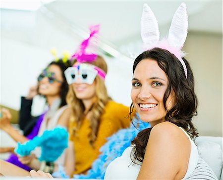 simsearch:6113-07148073,k - Woman wearing bunny ears at party Stock Photo - Premium Royalty-Free, Code: 6113-07148052