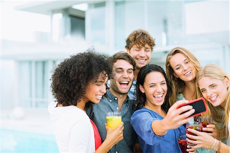 simsearch:6113-07148073,k - Friends taking self-portrait outdoors Stock Photo - Premium Royalty-Free, Code: 6113-07148004