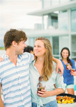 simsearch:6113-07543030,k - Couple hugging at barbecue Stock Photo - Premium Royalty-Free, Code: 6113-07148009