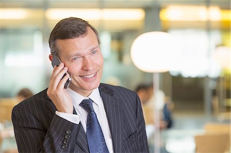 simsearch:649-07520071,k - Businessman talking on cell phone in office Stock Photo - Premium Royalty-Free, Code: 6113-07158960