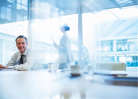 Businessman sitting in conference room Stock Photo - Premium Royalty-Free, Code: 6113-07158992