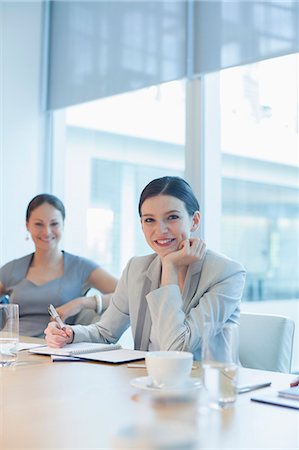 simsearch:6113-07159049,k - Businesswoman smiling in conference room Stock Photo - Premium Royalty-Free, Code: 6113-07158936