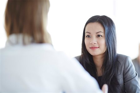 Business people talking in office Stock Photo - Premium Royalty-Free, Code: 6113-07159071