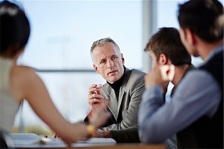 Business people talking in meeting Stock Photo - Premium Royalty-Free, Code: 6113-07159085