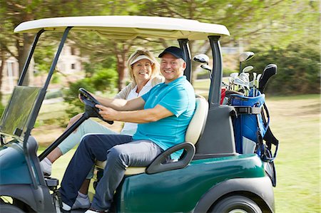 driver (golfclub) - Senior couple driving golf cart on course Foto de stock - Sin royalties Premium, Código: 6113-07159248