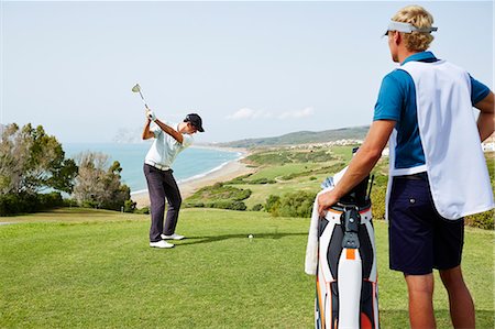 playing by the swing - Men playing golf on course Stock Photo - Premium Royalty-Free, Code: 6113-07159296