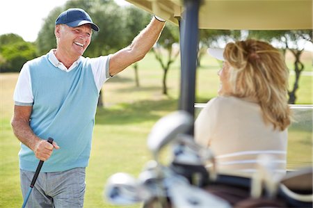 sports and golf - Senior couple in golf cart Stock Photo - Premium Royalty-Free, Code: 6113-07159219