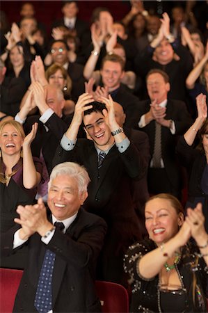 simsearch:6113-07542938,k - Enthusiastic theater audience clapping and cheering Photographie de stock - Premium Libres de Droits, Code: 6113-07159354