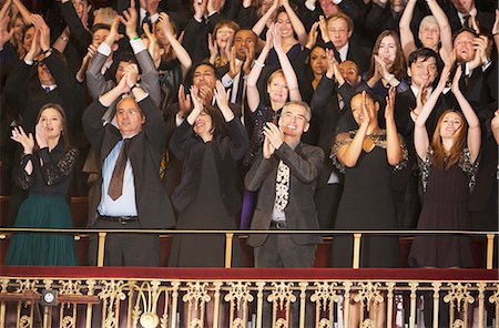 Enthusiastic audience clapping in theater balcony Stock Photo - Premium Royalty-Free, Code: 6113-07159383