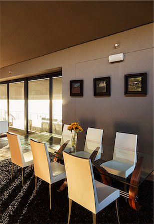 simsearch:6113-07542650,k - Chairs and table in modern dining room Foto de stock - Sin royalties Premium, Código: 6113-07159460