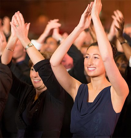 filipino ethnicity - Enthusiastic women clapping in theater audience Stock Photo - Premium Royalty-Free, Code: 6113-07159408