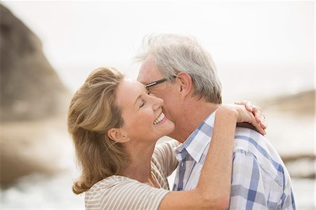 simsearch:6113-07159513,k - Older couple kissing on beach Stock Photo - Premium Royalty-Free, Code: 6113-07159558