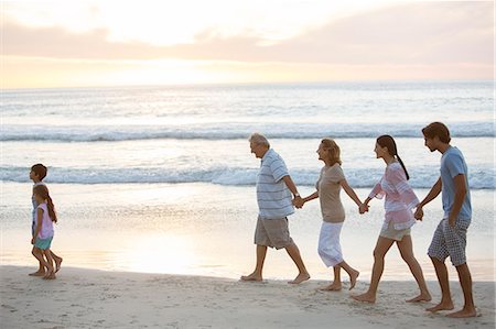 simsearch:6113-07241967,k - Multi-generation family walking on beach Stock Photo - Premium Royalty-Free, Code: 6113-07159522