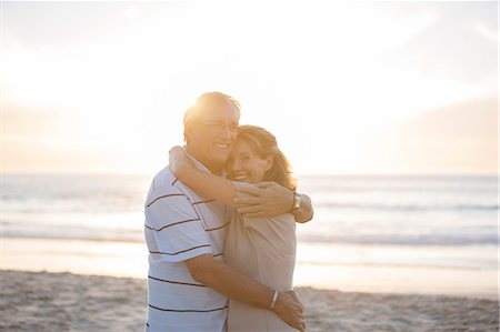 simsearch:6113-07159513,k - Senior couple hugging on beach Stock Photo - Premium Royalty-Free, Code: 6113-07159530