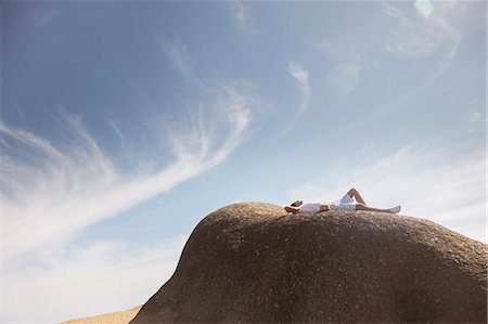 simsearch:649-06433219,k - Man relaxing on rock formation Stock Photo - Premium Royalty-Free, Code: 6113-07159667