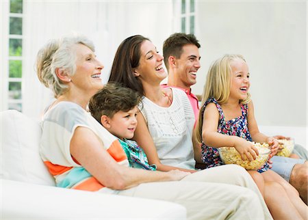 senior family sitting - Family watching television together Stock Photo - Premium Royalty-Free, Code: 6113-07159699