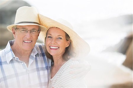 simsearch:6113-07159513,k - Older couple smiling on beach Stock Photo - Premium Royalty-Free, Code: 6113-07159624