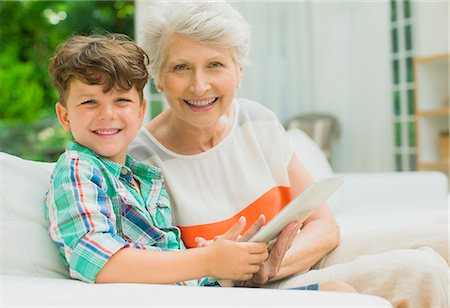 simsearch:6108-06904945,k - Older woman and grandson using digital tablet Stock Photo - Premium Royalty-Free, Code: 6113-07159721