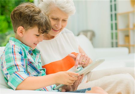 simsearch:6113-06908842,k - Older woman and grandson using digital tablet Stock Photo - Premium Royalty-Free, Code: 6113-07159729