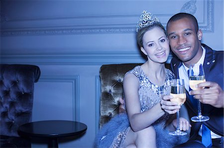 simsearch:6113-07543617,k - Portrait of well dressed couple toasting champagne flutes Stock Photo - Premium Royalty-Free, Code: 6113-07159880