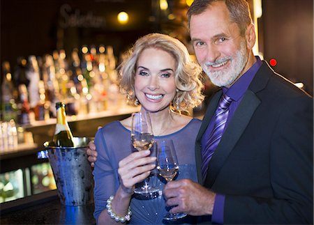 simsearch:6113-07543617,k - Portrait of well dressed couple drinking champagne in luxury bar Stock Photo - Premium Royalty-Free, Code: 6113-07159948