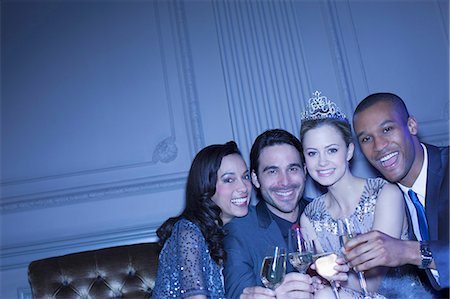 simsearch:6113-07543617,k - Portrait of happy friends toasting champagne flutes Stock Photo - Premium Royalty-Free, Code: 6113-07159910