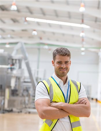 simsearch:6113-07160283,k - Worker smiling in factory Stock Photo - Premium Royalty-Free, Code: 6113-07160290