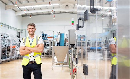 simsearch:6113-07160283,k - Worker smiling in factory Stock Photo - Premium Royalty-Free, Code: 6113-07160298