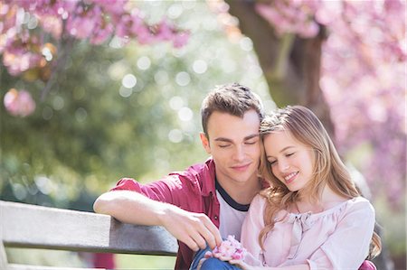 people sitting on bench - Couple hugging on park bench Stock Photo - Premium Royalty-Free, Code: 6113-07160591