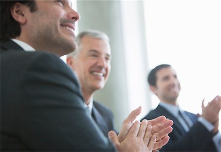 partnership business - Businessmen clapping in meeting Stock Photo - Premium Royalty-Free, Code: 6113-07160501