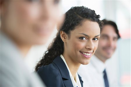 simsearch:6113-07159049,k - Businesswoman smiling in meeting Stock Photo - Premium Royalty-Free, Code: 6113-07160502