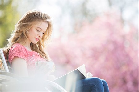 sunny woman outside park - Woman reading book on park bench Stock Photo - Premium Royalty-Free, Code: 6113-07160625