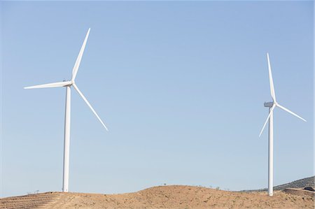 simsearch:6113-07589515,k - Wind turbines spinning in rural landscape Stock Photo - Premium Royalty-Free, Code: 6113-07160886