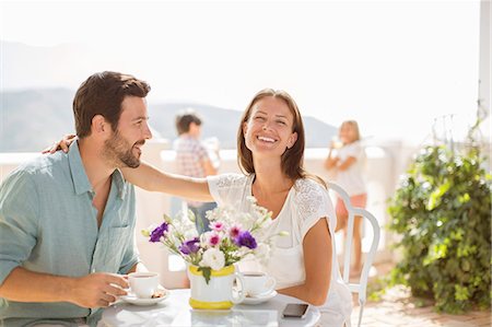 simsearch:6113-06720867,k - Couple enjoying coffee on balcony Stock Photo - Premium Royalty-Free, Code: 6113-07241984