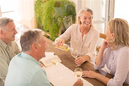 simsearch:6113-07242109,k - Senior couples drinking wine at dining table Stock Photo - Premium Royalty-Free, Code: 6113-07241995