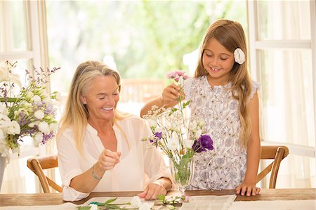 family dining room table - Grandmother and granddaughter arranging flowers Stock Photo - Premium Royalty-Free, Code: 6113-07242047