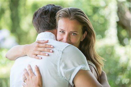 simsearch:6113-07543676,k - Couple hugging outdoors Stock Photo - Premium Royalty-Free, Code: 6113-07242087