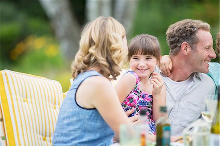 simsearch:6113-07242309,k - Family eating together outdoors Stock Photo - Premium Royalty-Free, Code: 6113-07242443